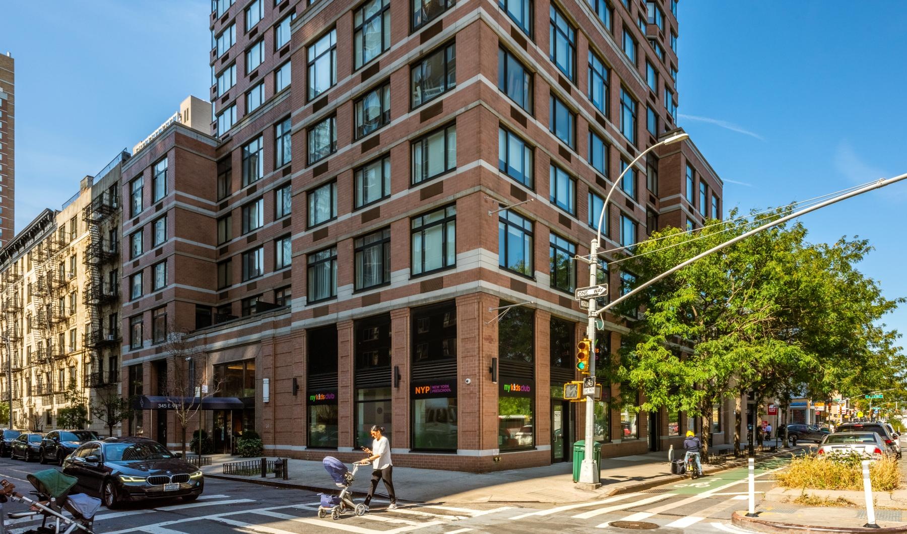 The essence of exceptional living a large building with a street in front of it