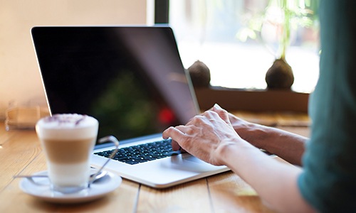 a person typing on a laptop